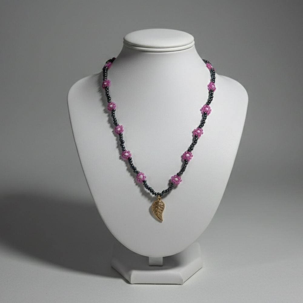 Elegant Pink and Black Beaded Necklace with Gold Leaf Pendant